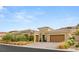 Inviting single story home featuring a tile roof, well-maintained landscaping, and a two-car garage at 21 Grand Masters Dr, Las Vegas, NV 89141
