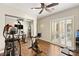 Home gym with mirrored closet doors, ceiling fan, and workout equipment at 21 Grand Masters Dr, Las Vegas, NV 89141