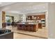 Gourmet kitchen with large island, granite countertops, and stainless steel appliances at 21 Grand Masters Dr, Las Vegas, NV 89141