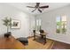 Bright home office with wood floors, modern furnishings, and natural light at 21 Grand Masters Dr, Las Vegas, NV 89141