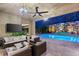 Charming outdoor living area includes lounge seating, a stone accent wall and scenic views at 21 Grand Masters Dr, Las Vegas, NV 89141