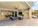 Covered patio with outdoor furniture, a ceiling fan, and seamless indoor-outdoor living at 21 Grand Masters Dr, Las Vegas, NV 89141