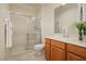 Bathroom features a glass shower, stylish vanity with sink, and neutral wall paint at 2163 Bannerwood St, Henderson, NV 89044