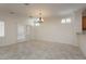 Open dining space with tile floors, plantation shutters, and a chandelier above at 2163 Bannerwood St, Henderson, NV 89044