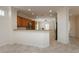 Open-concept kitchen boasts granite countertops, stainless steel appliances, and a breakfast bar at 2163 Bannerwood St, Henderson, NV 89044