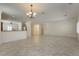 Spacious living room featuring tile floors and a smooth transition to the open-concept kitchen at 2163 Bannerwood St, Henderson, NV 89044