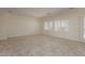 Neutral living area with tile flooring, plantation shutters, and plenty of natural light at 2163 Bannerwood St, Henderson, NV 89044