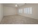A room features neutral walls, beautiful window shutters, and a ceiling fan at 2163 Bannerwood St, Henderson, NV 89044