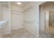 Walk-in closet with wire shelving and tile floors, conveniently located near the bathroom at 2163 Bannerwood St, Henderson, NV 89044