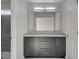 Bathroom featuring a double vanity with modern fixtures and tiled shower at 2212 Warm Walnut Dr, Las Vegas, NV 89134