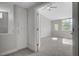 Open bedroom doorway with view of ceiling fan and large windows at 2212 Warm Walnut Dr, Las Vegas, NV 89134