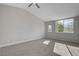 Spacious carpeted bedroom with vaulted ceiling and natural light from multiple windows at 2212 Warm Walnut Dr, Las Vegas, NV 89134