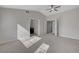 Bright bedroom with vaulted ceiling, neutral carpet, and access to bathroom and closet at 2212 Warm Walnut Dr, Las Vegas, NV 89134