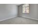 Bedroom featuring neutral carpet and a single window with natural light at 2212 Warm Walnut Dr, Las Vegas, NV 89134