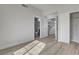 Bedroom featuring wood-look flooring, walk-in closet, and ensuite bathroom at 2212 Warm Walnut Dr, Las Vegas, NV 89134