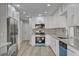 Updated kitchen features modern appliances, white cabinets, and stainless steel refrigerator at 2212 Warm Walnut Dr, Las Vegas, NV 89134