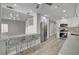 Open kitchen with counter seating flowing into the living room at 2212 Warm Walnut Dr, Las Vegas, NV 89134