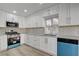 Updated kitchen boasts modern appliances, sleek cabinetry, and ample counter space for cooking and entertaining at 2212 Warm Walnut Dr, Las Vegas, NV 89134
