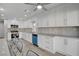 Modern kitchen with white cabinetry, stainless steel appliances, and a convenient breakfast bar area at 2212 Warm Walnut Dr, Las Vegas, NV 89134