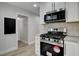 Modern kitchen features stainless steel appliances and crisp white cabinetry at 2212 Warm Walnut Dr, Las Vegas, NV 89134