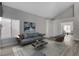 Comfortable living room with modern decor, including sofa, rug, and wood flooring at 2212 Warm Walnut Dr, Las Vegas, NV 89134