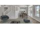 Bright living area featuring a dining area, staircase, and stylish furnishings at 2212 Warm Walnut Dr, Las Vegas, NV 89134