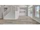 Open living room with stairs, modern flooring, and access to the backyard pool at 2212 Warm Walnut Dr, Las Vegas, NV 89134