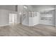 Spacious living room featuring wood floors, staircase, and bright lighting at 2212 Warm Walnut Dr, Las Vegas, NV 89134