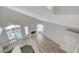 This living room offers wood-look floors, a modern fireplace, and pool views at 2212 Warm Walnut Dr, Las Vegas, NV 89134