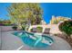Backyard pool with private walled yard and mature landscaping, creating a serene outdoor space at 2212 Warm Walnut Dr, Las Vegas, NV 89134