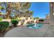 Backyard pool area with mature trees offering shade, privacy, and a refreshing swimming experience at 2212 Warm Walnut Dr, Las Vegas, NV 89134