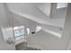 Bright, modern staircase with railing leads to living space with fireplace and pool view at 2212 Warm Walnut Dr, Las Vegas, NV 89134