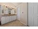 Bright bathroom featuring a double vanity with granite countertop and tile flooring at 2416 Sun Shores Dr, Las Vegas, NV 89128