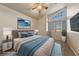 Staged bedroom with a large window, and a calming blue color scheme at 2416 Sun Shores Dr, Las Vegas, NV 89128