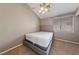 This bedroom features plush carpet, a ceiling fan, and a neutral color palette at 2416 Sun Shores Dr, Las Vegas, NV 89128