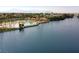 A luxurious community pool and beach area alongside a serene lake, perfect for relaxation and recreation at 2416 Sun Shores Dr, Las Vegas, NV 89128