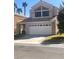 Charming two-story home with a two-car garage and well-maintained landscaping at 2416 Sun Shores Dr, Las Vegas, NV 89128