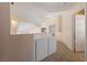 Well-lit upper hallway with storage, carpet, and access to additional rooms at 2416 Sun Shores Dr, Las Vegas, NV 89128