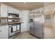 Modern kitchen with stainless steel appliances and plenty of cabinet space at 2416 Sun Shores Dr, Las Vegas, NV 89128