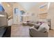 Bright living room featuring high ceilings, large windows, and an open floor plan at 2416 Sun Shores Dr, Las Vegas, NV 89128