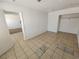 Bedroom features tile floors, closet, and neutral color scheme at 2513 Cedar Ave, Las Vegas, NV 89101