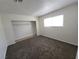 Bedroom featuring neutral walls, a window, a built-in closet, and carpeted floors at 2513 Cedar Ave, Las Vegas, NV 89101