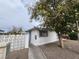 Modest single-story home featuring a white stucco facade and desert landscaping at 2513 Cedar Ave, Las Vegas, NV 89101