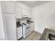 Kitchen features white appliances, granite countertops, and tile flooring at 2513 Cedar Ave, Las Vegas, NV 89101
