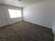 Bright living room featuring neutral carpet, neutral paint, and a window at 2513 Cedar Ave, Las Vegas, NV 89101