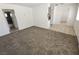 Cozy living room featuring tile and carpet flooring, neutral paint, and modern lighting at 2513 Cedar Ave, Las Vegas, NV 89101