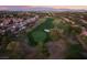 An aerial view showcases the golf course and surrounding neighborhood, enveloped in mature trees at 2528 Sunup Dr, Las Vegas, NV 89134