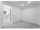 Bright, minimalist bedroom offers an ensuite bathroom with double vanity, and shower at 2528 Sunup Dr, Las Vegas, NV 89134