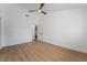 This bright room features vinyl floors, neutral paint, a ceiling fan, and an ensuite bathroom at 2528 Sunup Dr, Las Vegas, NV 89134