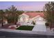 Beautiful daytime aerial view showcases a landscaped front yard and desert landscaping at 2528 Sunup Dr, Las Vegas, NV 89134